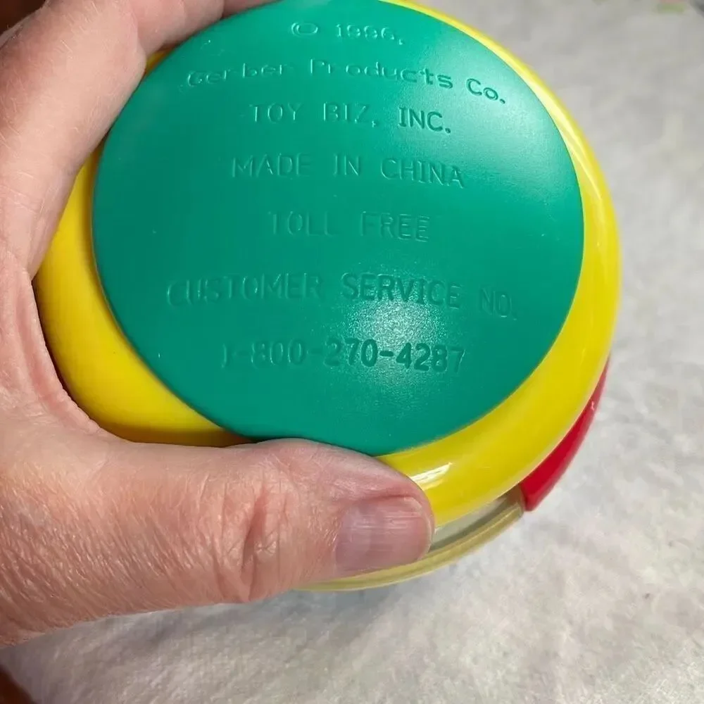 1996, Ring ‘n Roll Gerber Products Co. Toy Biz, Inc roundish rolling rattle infa